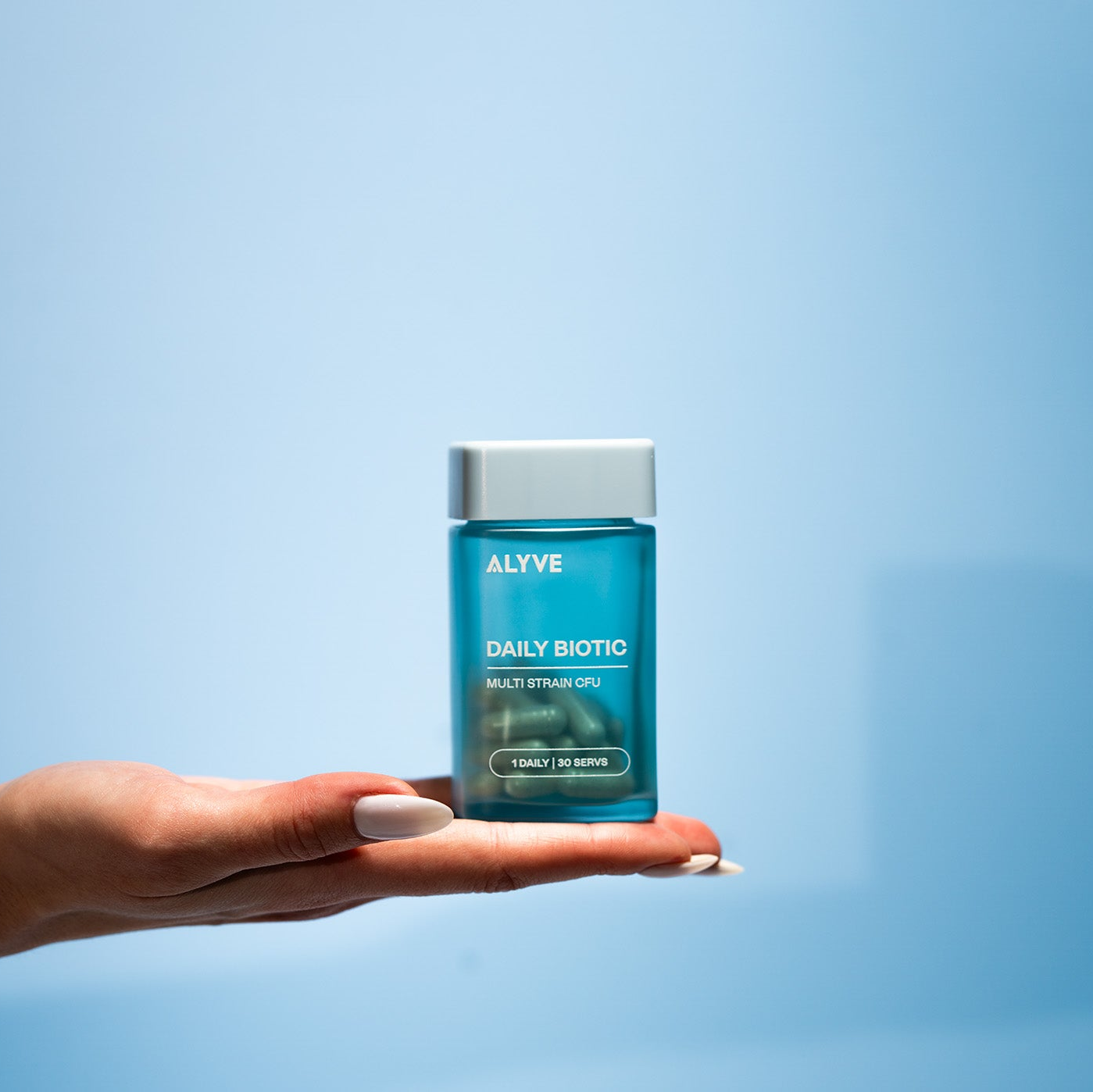 Hand Holding Biotic Bottle